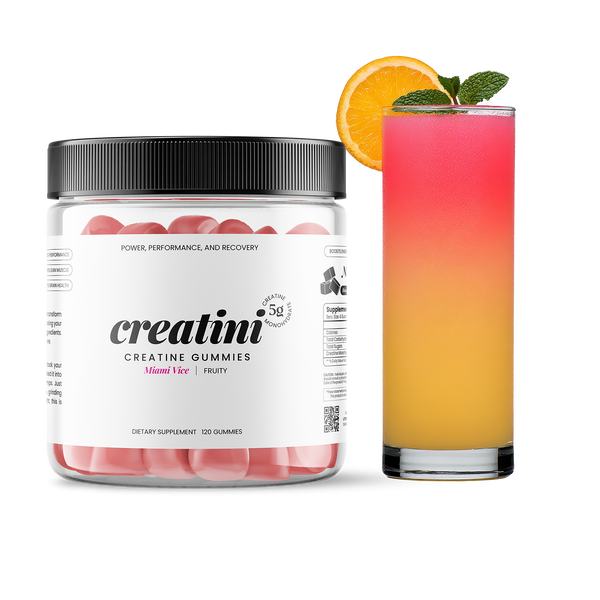 Creatini gummies container next to a colorful cocktail with an orange slice and mint leaf. Miami - Vice Flavor