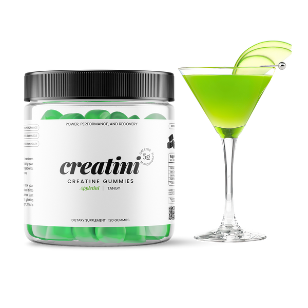 Creatine gummies container next to a green cocktail with green apple slices garnishing on a white background